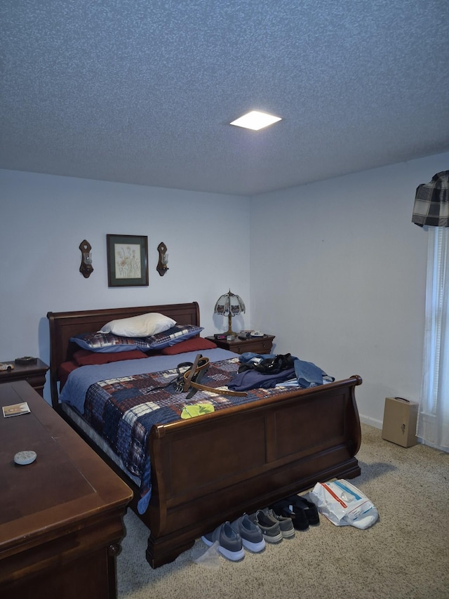 carpeted bedroom with a textured ceiling