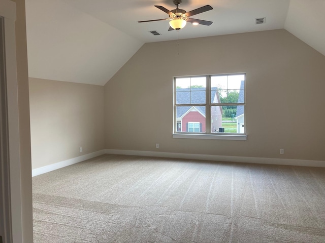 additional living space featuring lofted ceiling, ceiling fan, and carpet