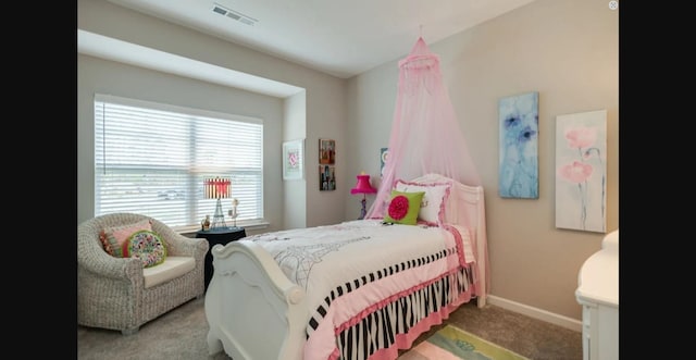 bedroom with carpet, visible vents, and baseboards