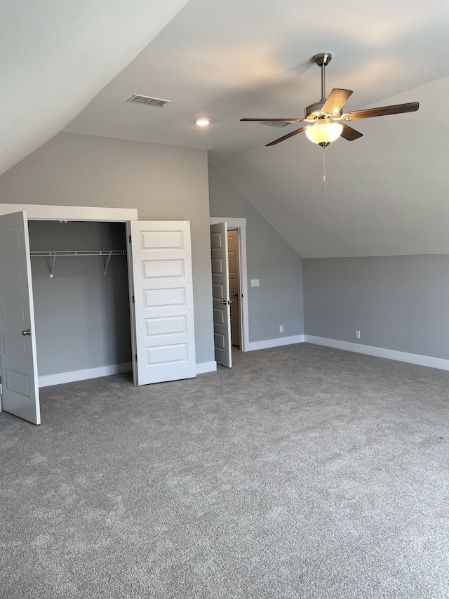 additional living space with lofted ceiling, a ceiling fan, visible vents, and baseboards