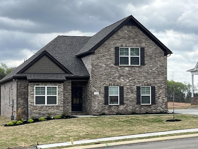 609 Spring Hill Dr, Smyrna, TN 37167 - view of front of property featuring a front lawn, brick siding, and a shingled roof