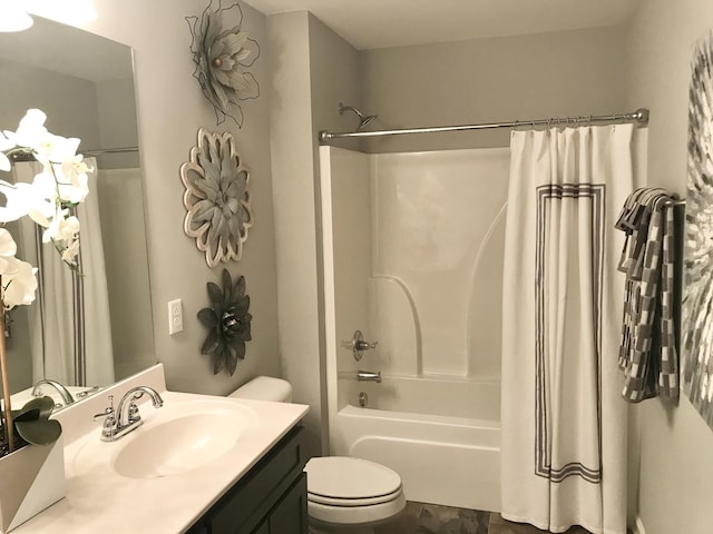 bathroom with vanity, toilet, and shower / tub combo with curtain