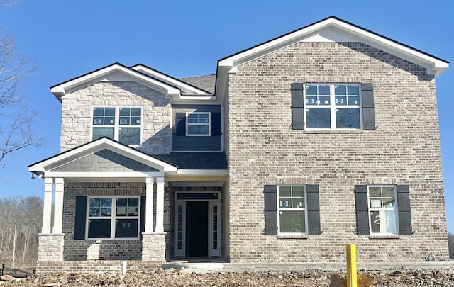 craftsman house with brick siding