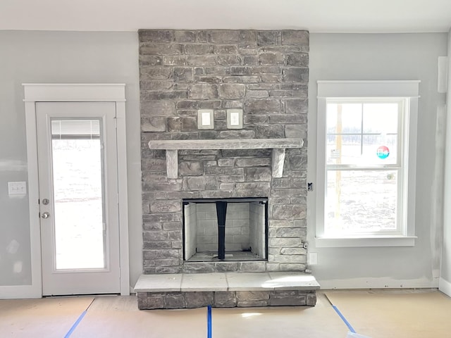 unfurnished living room featuring a fireplace