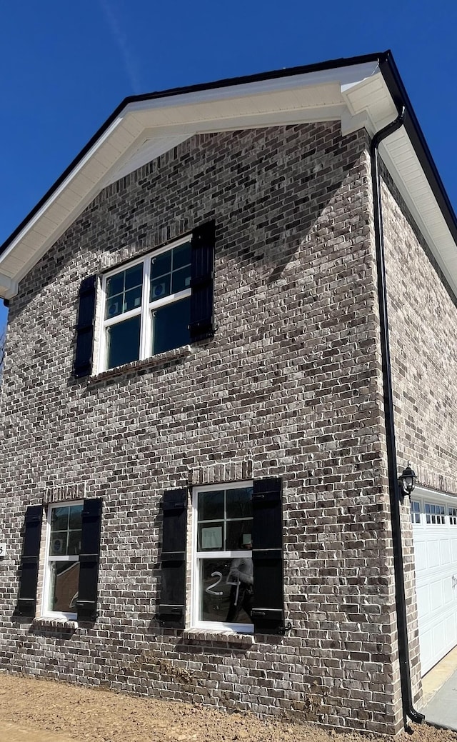 view of side of property featuring a garage