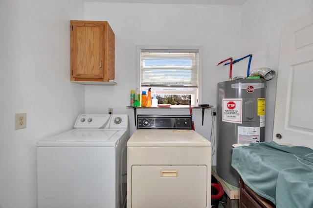 laundry room featuring water heater, cabinets, and washing machine and clothes dryer