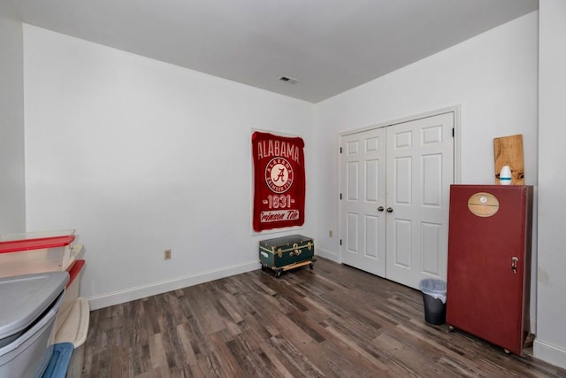 misc room with dark wood-type flooring