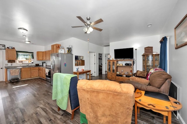 living room with dark hardwood / wood-style floors, ceiling fan, and sink