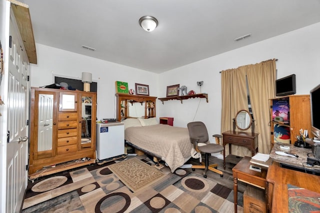 bedroom featuring hardwood / wood-style floors