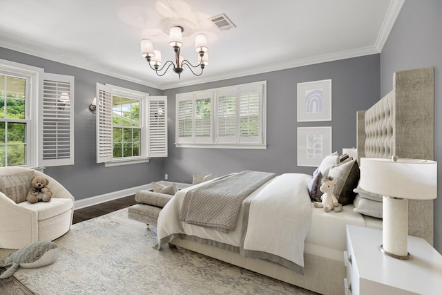 bedroom featuring multiple windows, hardwood / wood-style floors, ornamental molding, and a notable chandelier