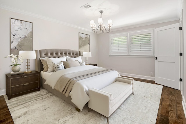 bedroom featuring wood-type flooring, crown molding, and a chandelier