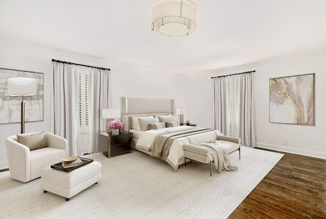 bedroom featuring hardwood / wood-style floors and crown molding