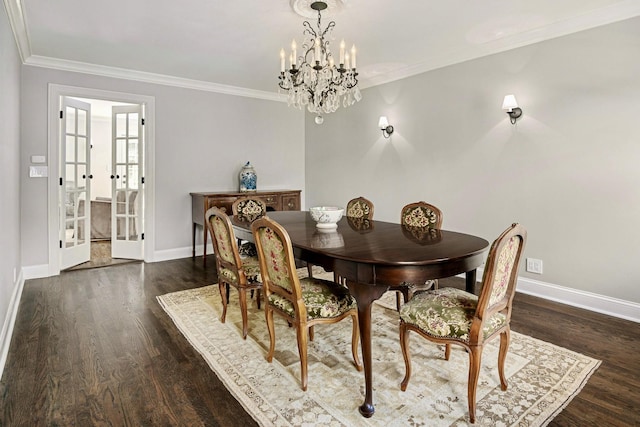 dining area featuring french doors, ornamental molding, dark hardwood / wood-style floors, and an inviting chandelier