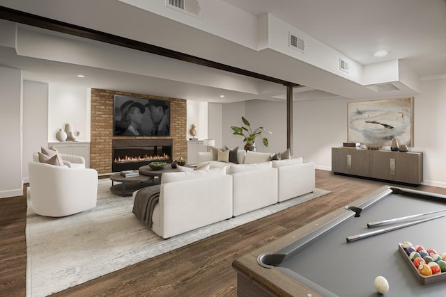 interior space featuring dark hardwood / wood-style flooring, a fireplace, and billiards