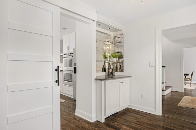 hallway featuring dark wood-type flooring