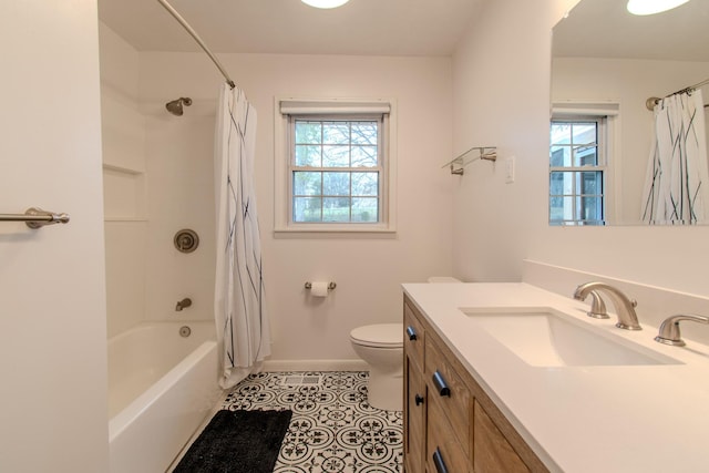 full bathroom with tile patterned flooring, shower / bath combination with curtain, vanity, and toilet