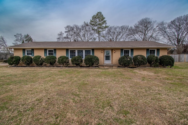 single story home with a front yard