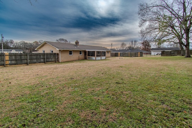 view of yard featuring a sunroom