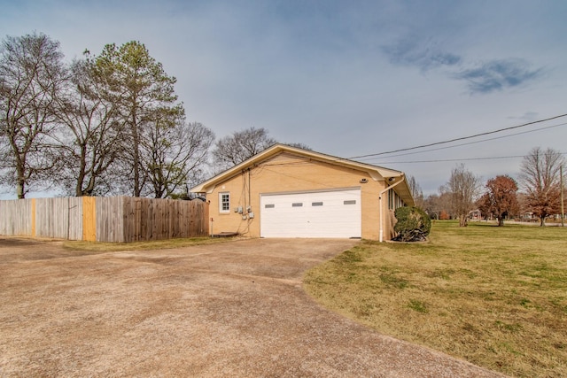 view of side of home with a lawn