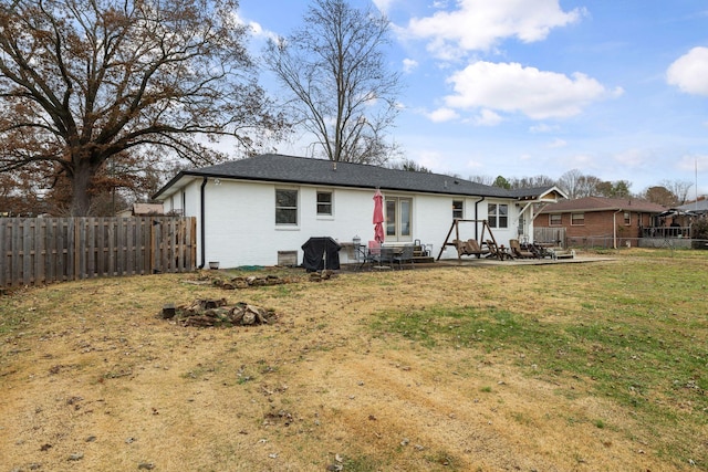 back of house with a yard