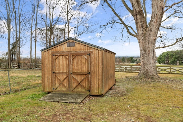 view of outdoor structure with a rural view