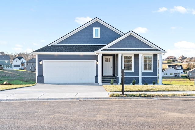 view of front facade with a garage and a front yard