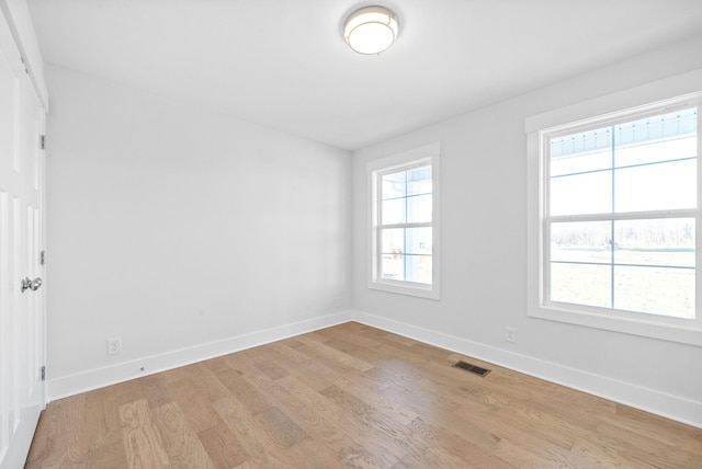 empty room with light wood-type flooring