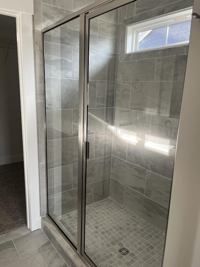 full bathroom featuring a shower stall