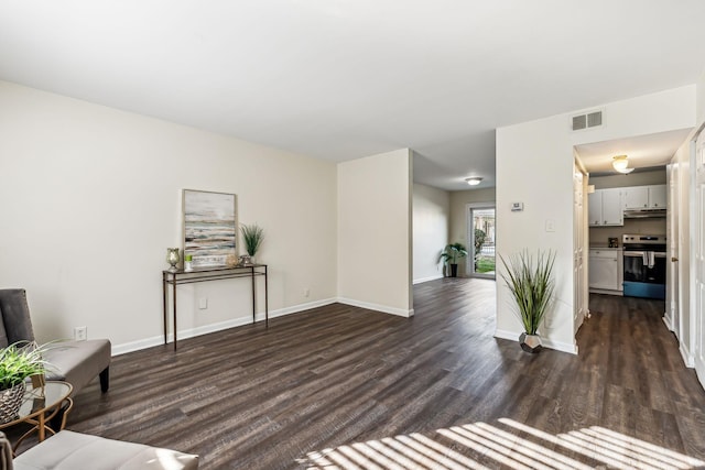 living area with dark hardwood / wood-style flooring