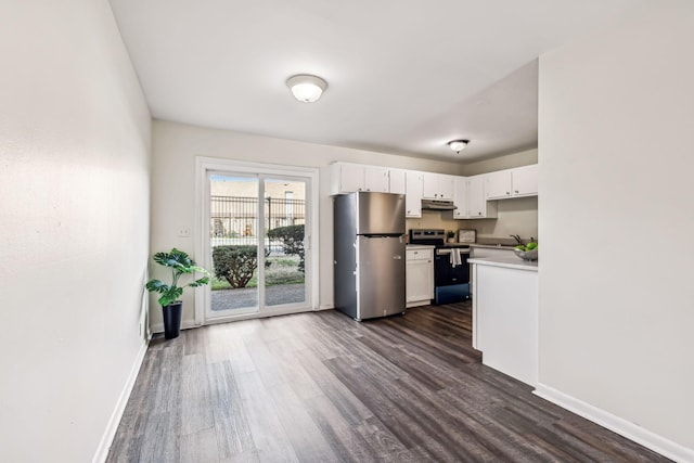 kitchen featuring white cabinets, dark hardwood / wood-style floors, sink, and appliances with stainless steel finishes