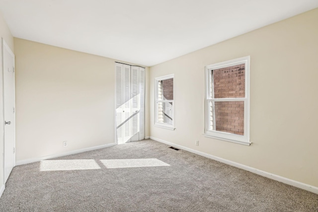 unfurnished bedroom with light carpet