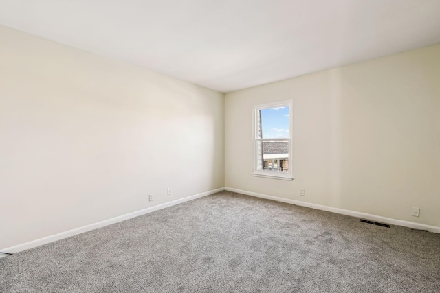 unfurnished room with carpet flooring