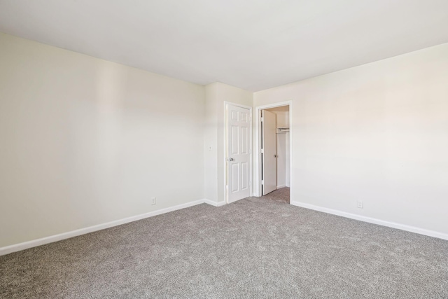 unfurnished room featuring carpet