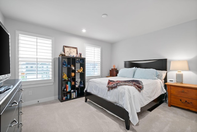 bedroom featuring light colored carpet