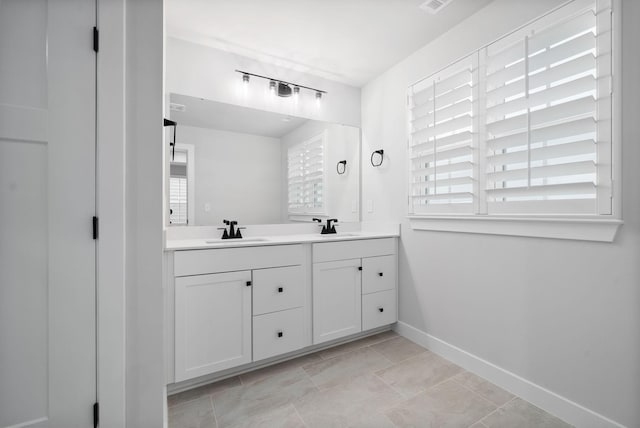 bathroom featuring vanity and a healthy amount of sunlight