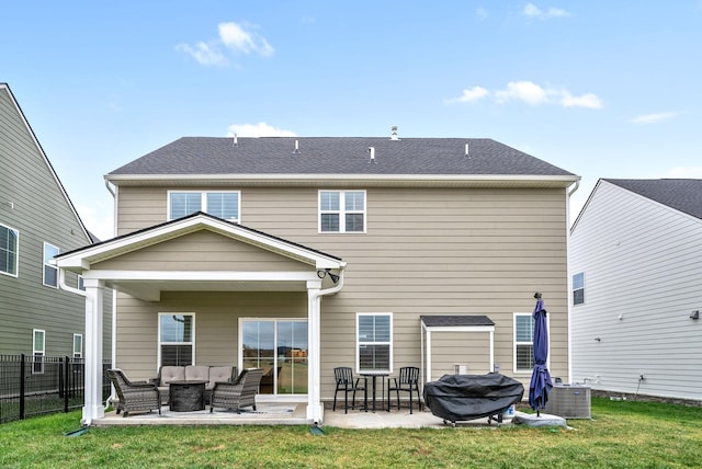 rear view of house featuring an outdoor living space, central AC unit, a patio area, and a lawn