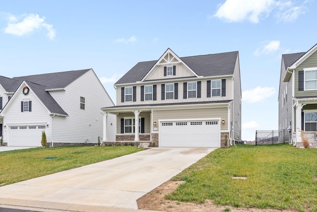 view of front of home with a front yard and a garage