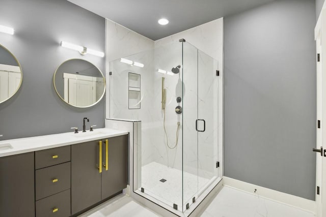 bathroom featuring vanity and a shower with shower door