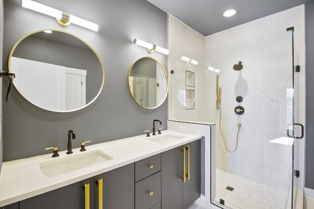 bathroom featuring vanity and a shower with shower door