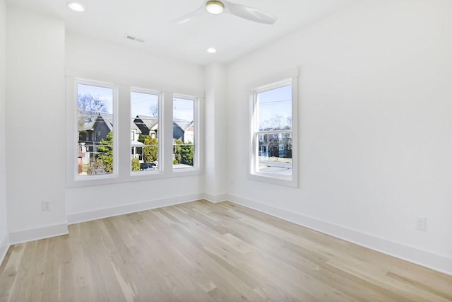 unfurnished room featuring ceiling fan and light hardwood / wood-style flooring