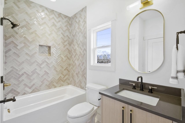 full bathroom with vanity, toilet, and tiled shower / bath