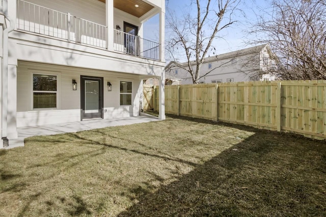 view of yard with a balcony and a patio area