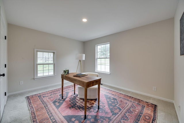 office space with light colored carpet