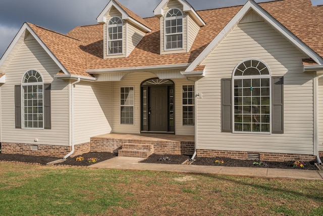 exterior space featuring a lawn and a porch