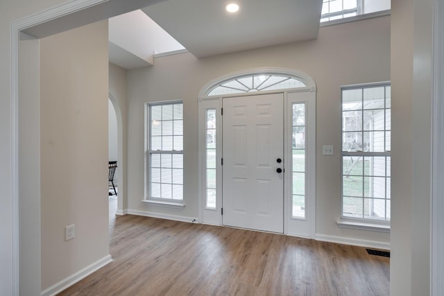 entrance foyer with light hardwood / wood-style flooring and plenty of natural light