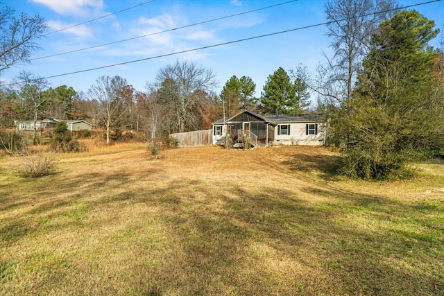 view of yard featuring a sunroom