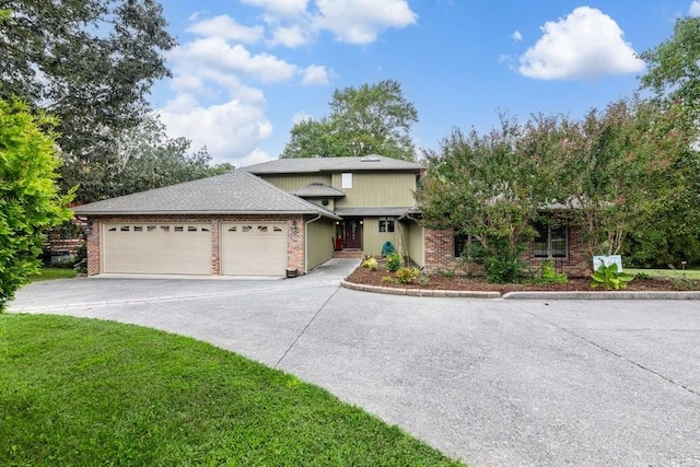 view of front facade featuring a front yard and a garage