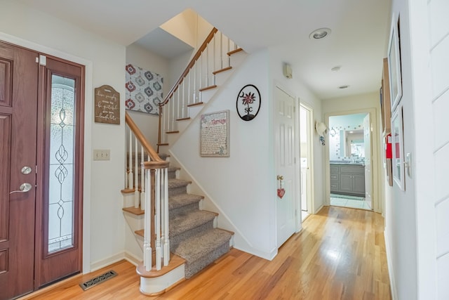 entrance foyer featuring light hardwood / wood-style flooring and plenty of natural light