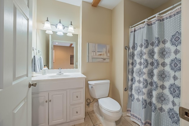 bathroom with tile patterned flooring, vanity, toilet, and walk in shower