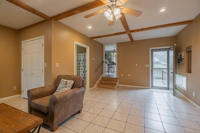 tiled living room featuring beamed ceiling and ceiling fan